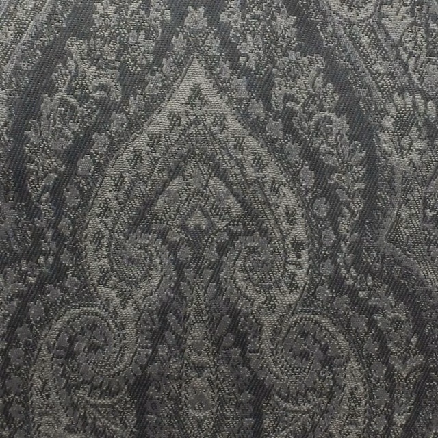 Charcoal silver woven fabric with tonal diamonds and scrolling ornamental motifs