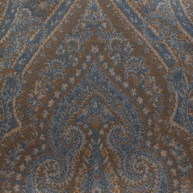 Spice-brown woven textile with blue-grey damask scrolls and angular bands