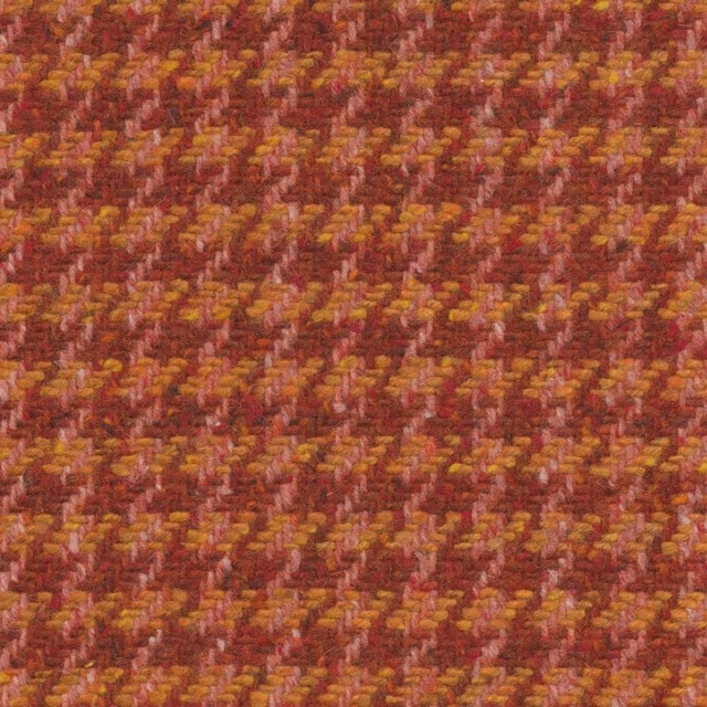 Close-up of burgundy spice weave with mustard flecks and broken diagonal texture