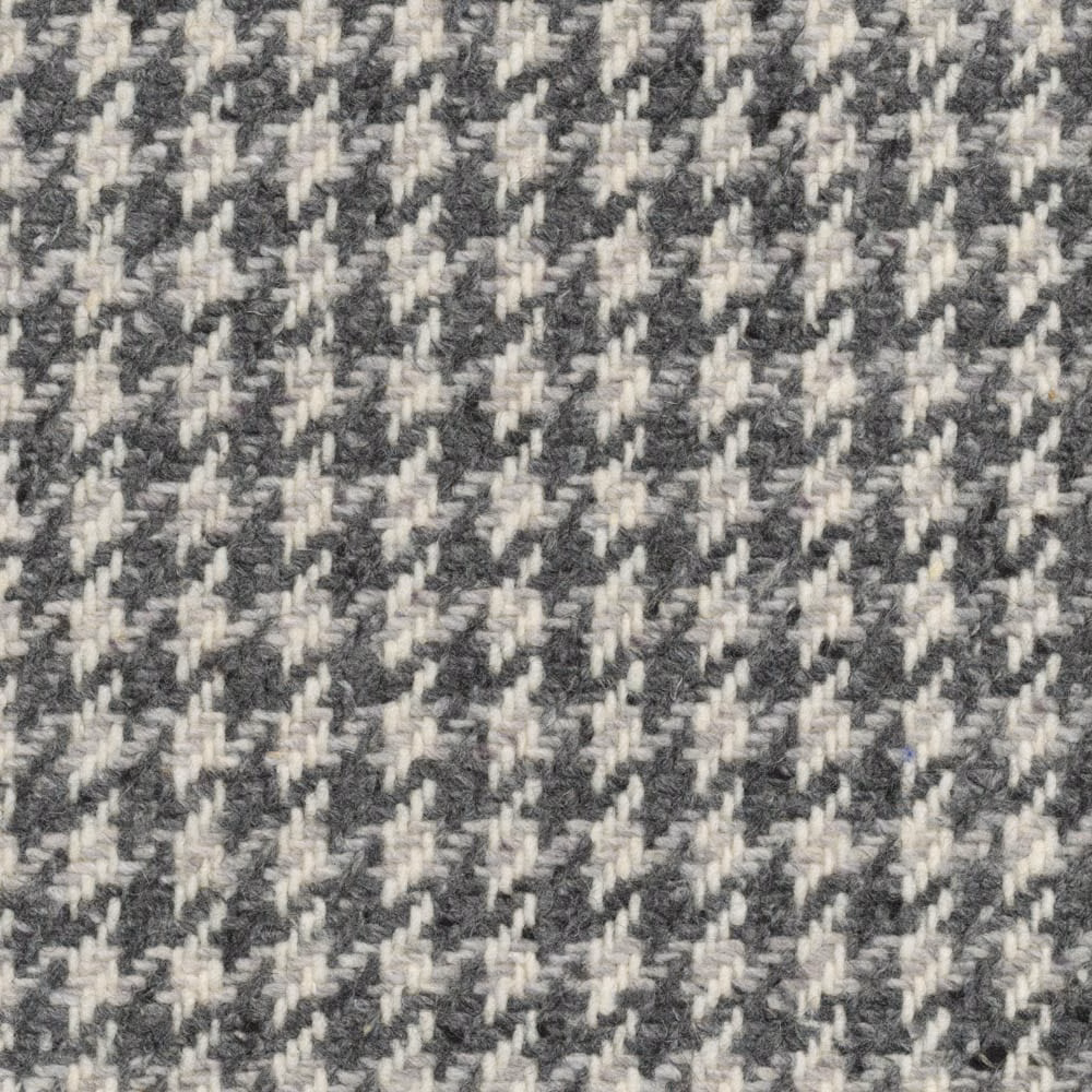 Charcoal and ivory textured houndstooth weave with softly irregular raised yarns