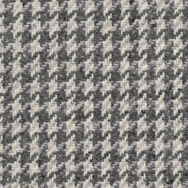 Charcoal and ivory textured houndstooth weave with softly irregular raised yarns
