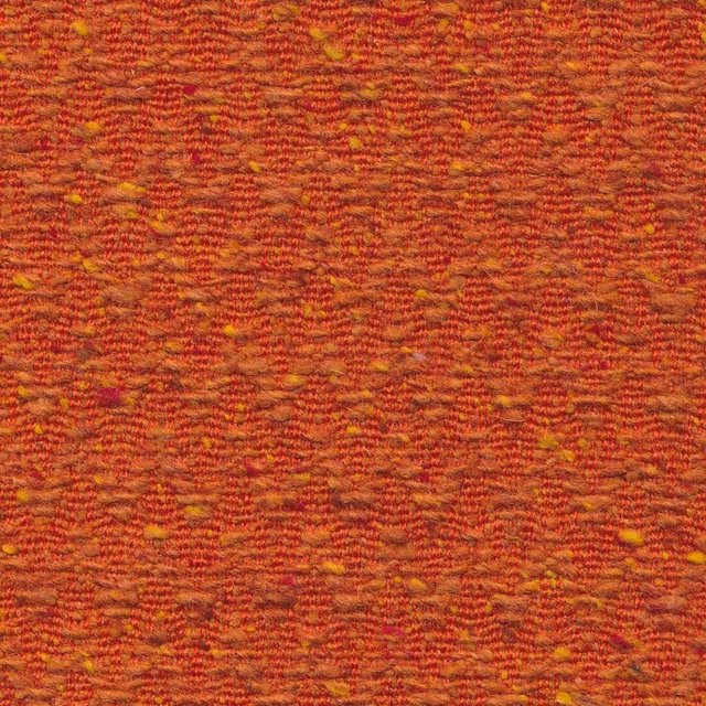 Ember red and rust woven chevron fabric with golden flecks and tactile texture