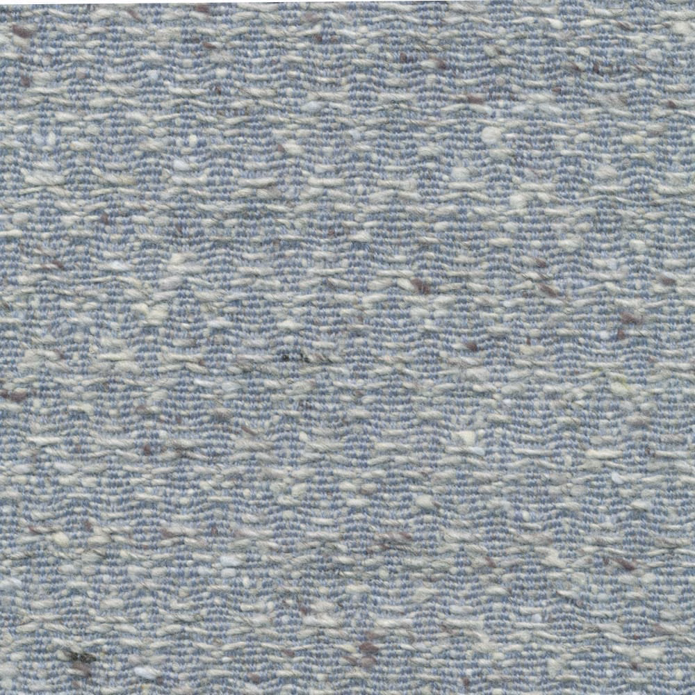 Close-up of cool blue-grey fabric with pale broken chevron weave