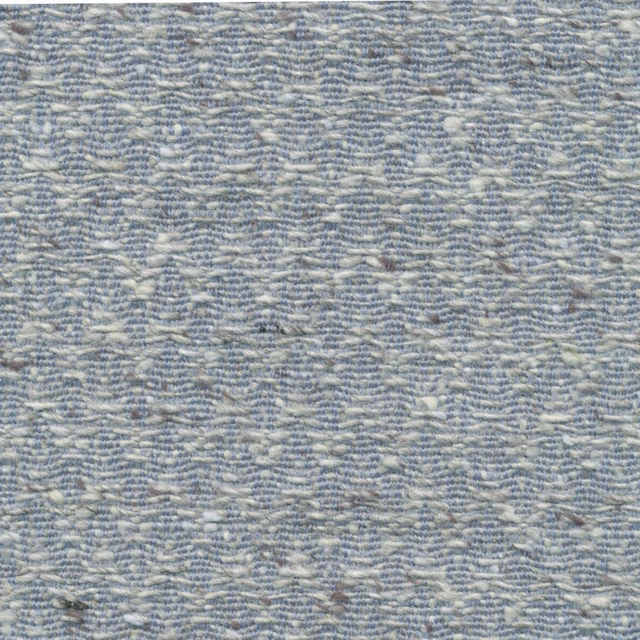 Close-up of cool blue-grey fabric with pale broken chevron weave