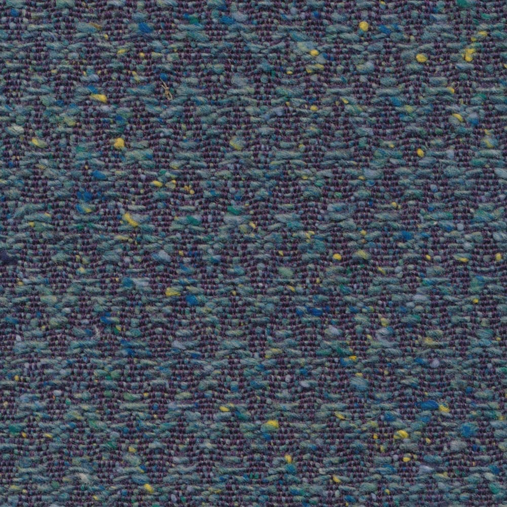 Close-up of dense mottled teal weave with plum, blue and yellow flecks