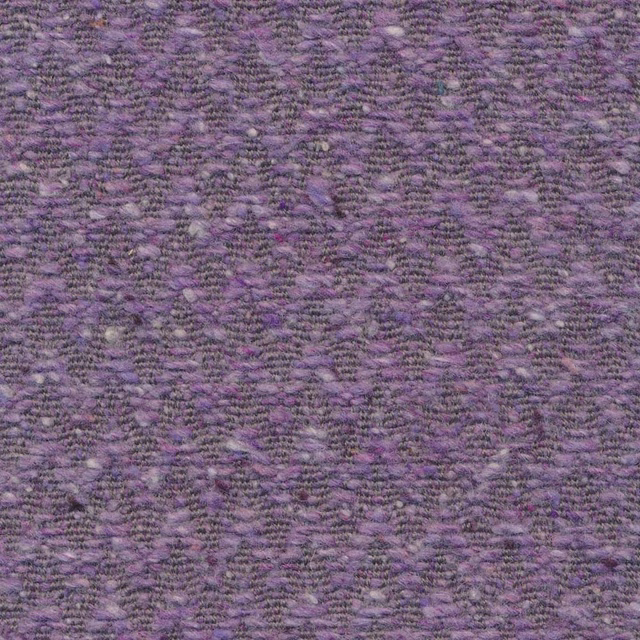 Close-up of muted violet and plum nubby weave forming a soft chevron pattern