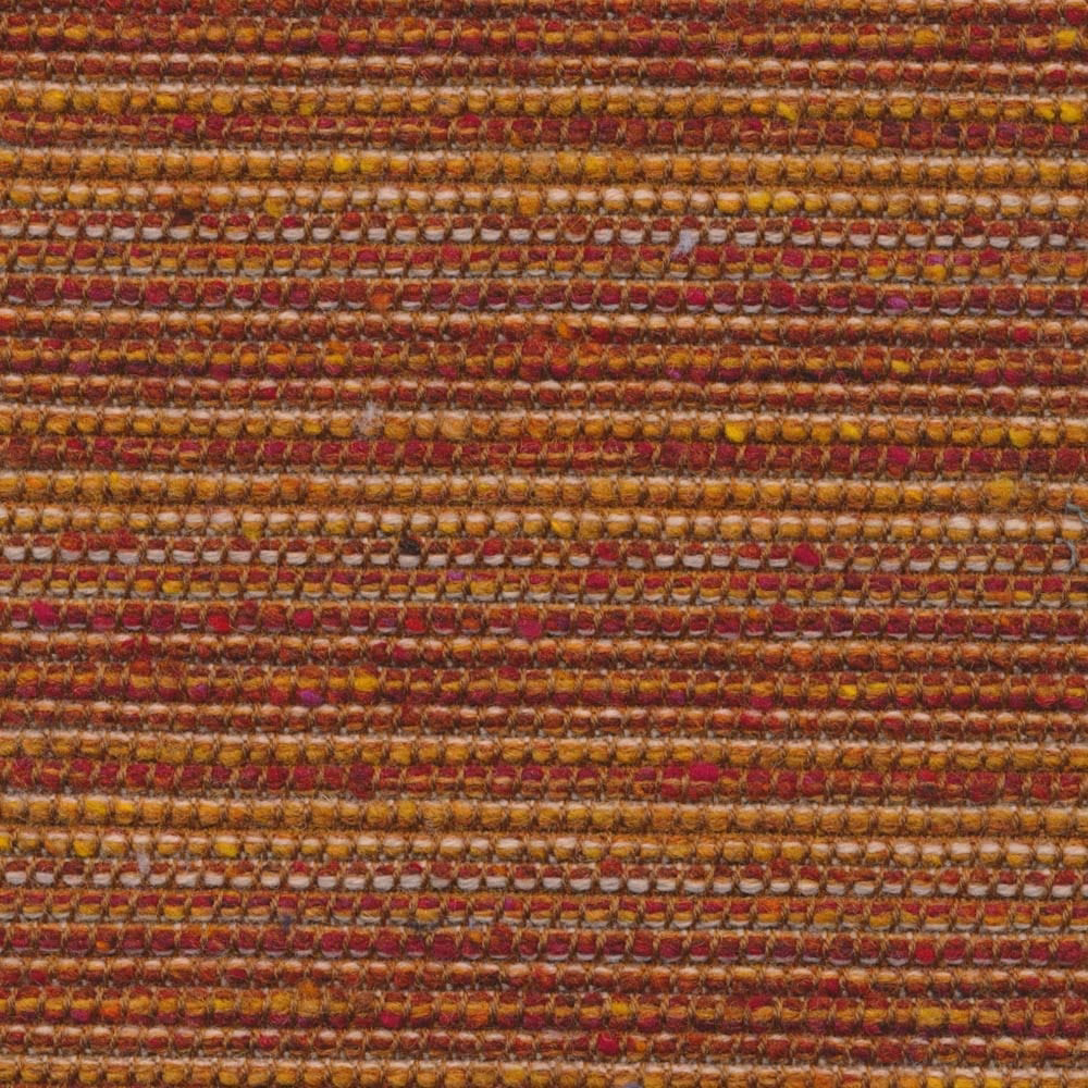 Close-up of ember rust upholstery weave with ochre, tan and burgundy horizontal rows