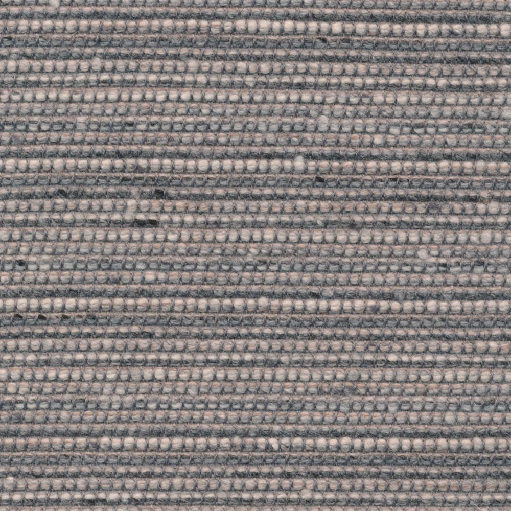 Close view of silver-grey woven rows with charcoal flecks and tactile texture