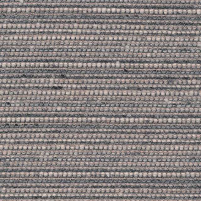 Close view of silver-grey woven rows with charcoal flecks and tactile texture