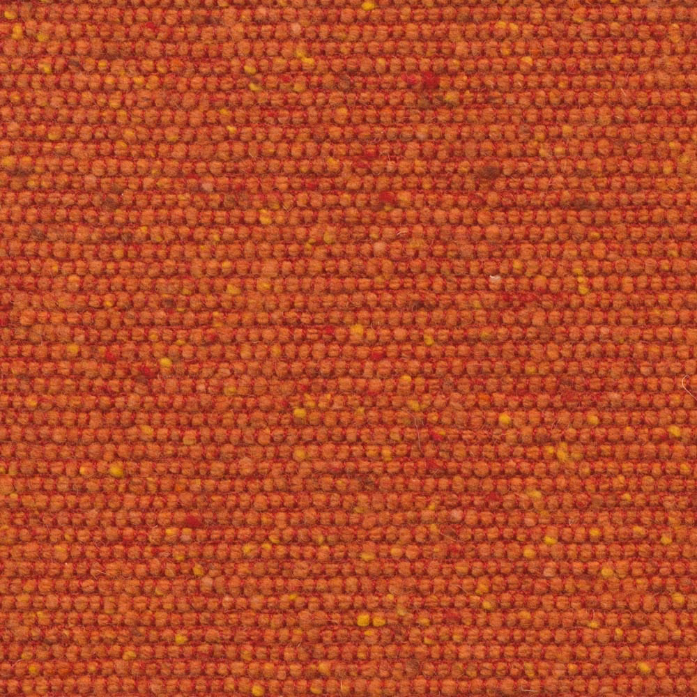 Burnt orange nubby weave with red shading and scattered ochre flecks