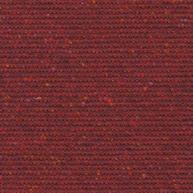 Close-up of dense rosehip-red weave with plum shadows and rust flecks