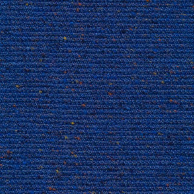 Deep royal-blue nubby weave with horizontal texture and scattered ochre and rust flecks