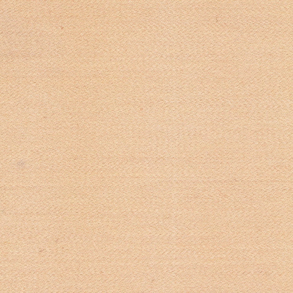 Warm ivory sateen fabric with a fine, subtly ribbed surface catching the light