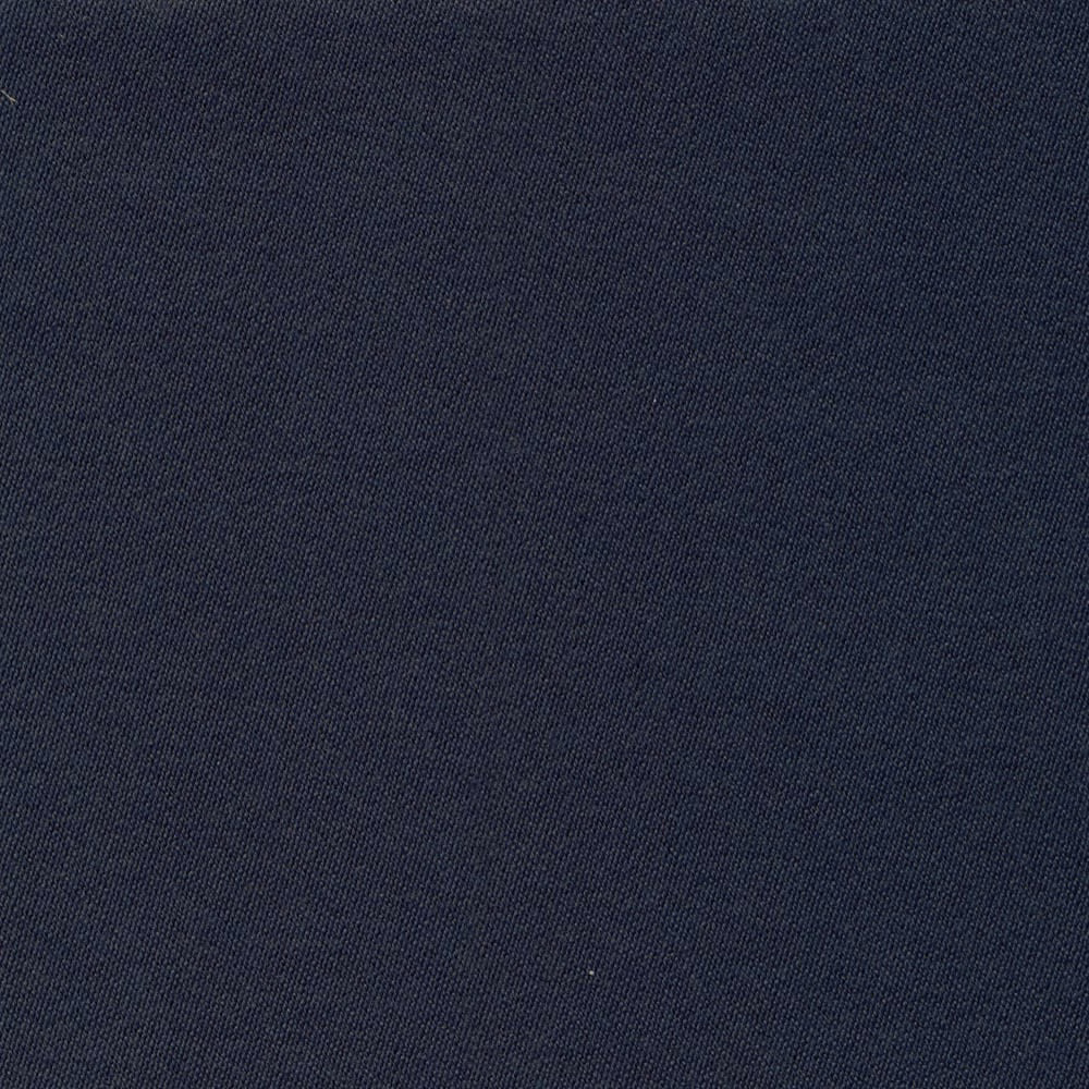 Close-up of deep navy blue plain sateen fabric with a fine, subtly textured weave