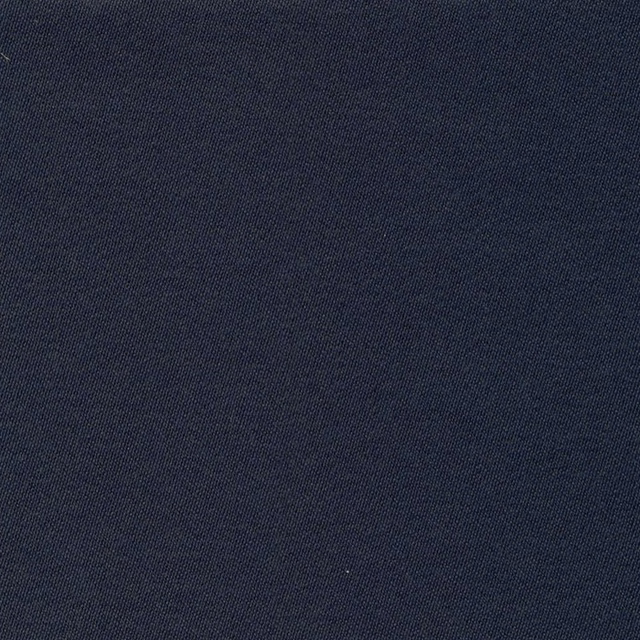 Close-up of deep navy blue plain sateen fabric with a fine, subtly textured weave