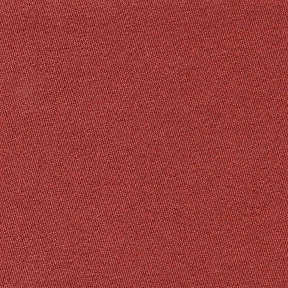 Close-up of muted tulip-red sateen fabric with fine vertical woven texture