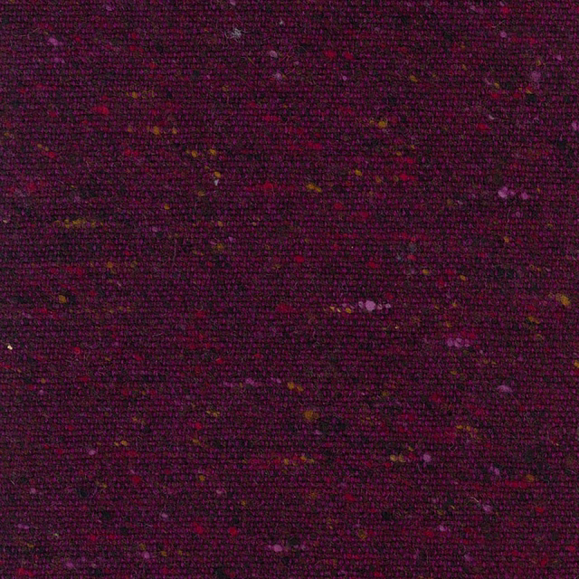 Deep plum woven fabric with scattered pink, violet and ochre flecks