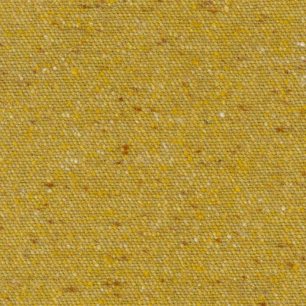 Close-up of mustard-gold woven fabric with cream, ochre and brown flecks