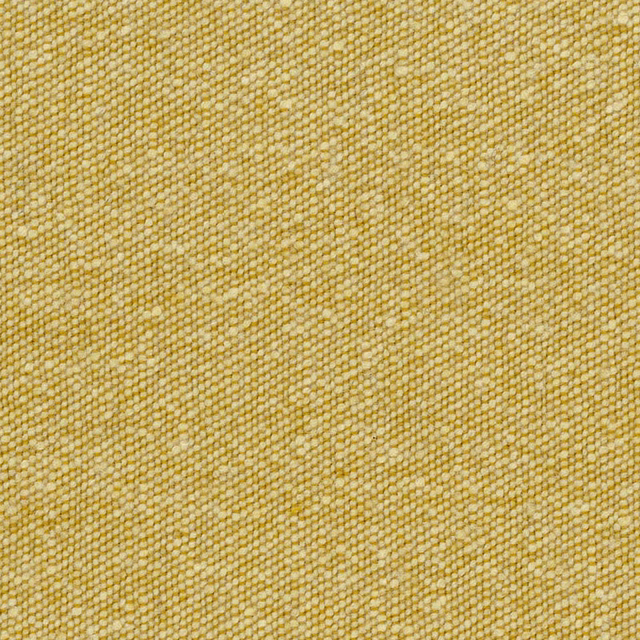 Warm buttercup-yellow woven textile with cream flecks and fine pebbled texture