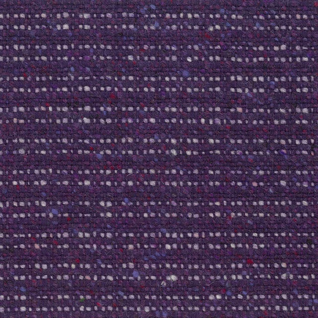 Close-up of dark purple woven textile with lilac, cream, blue and red flecks