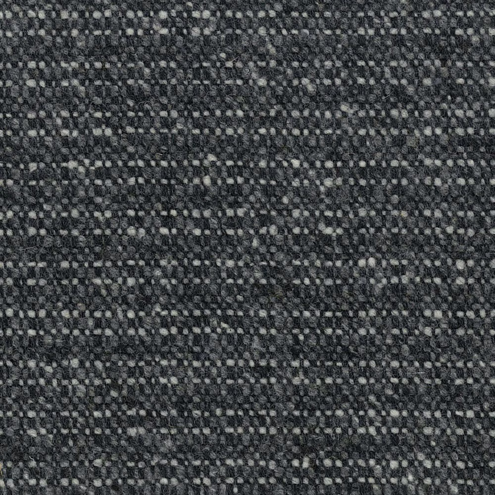 Close-up of charcoal-grey woven fabric with pale pebble flecks and irregular texture