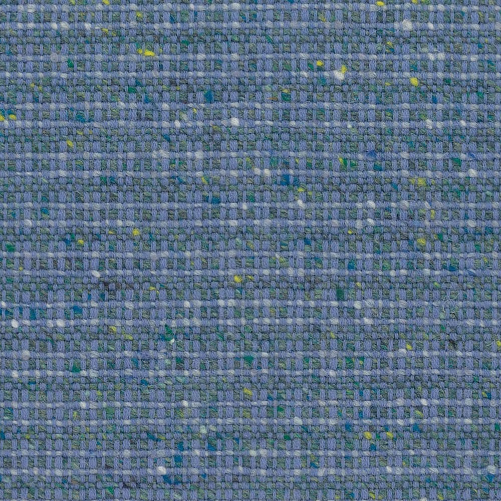 Close-up of blue-grey woven cloth with green and yellow flecks