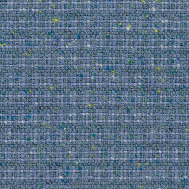 Close-up of blue-grey woven cloth with green and yellow flecks