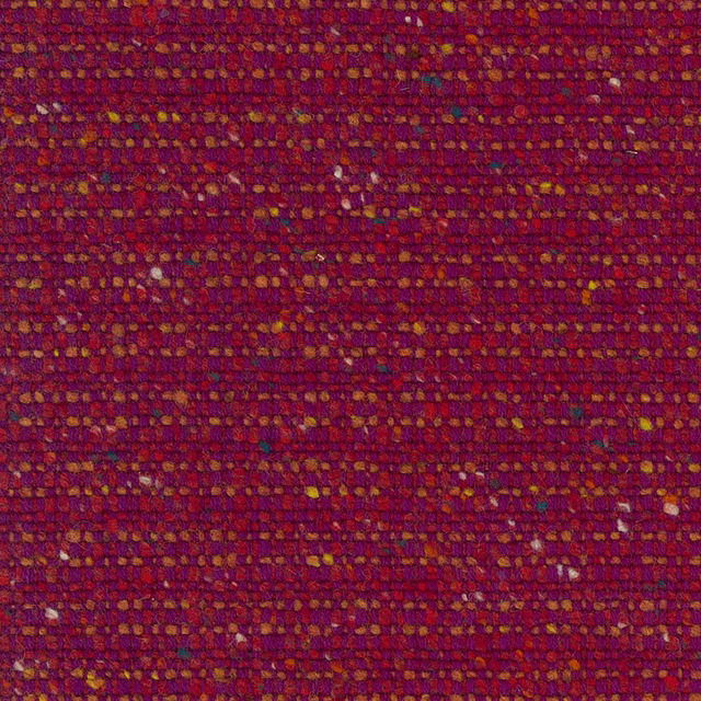 Dense berry-red woven fabric with ochre, rust and purple flecks