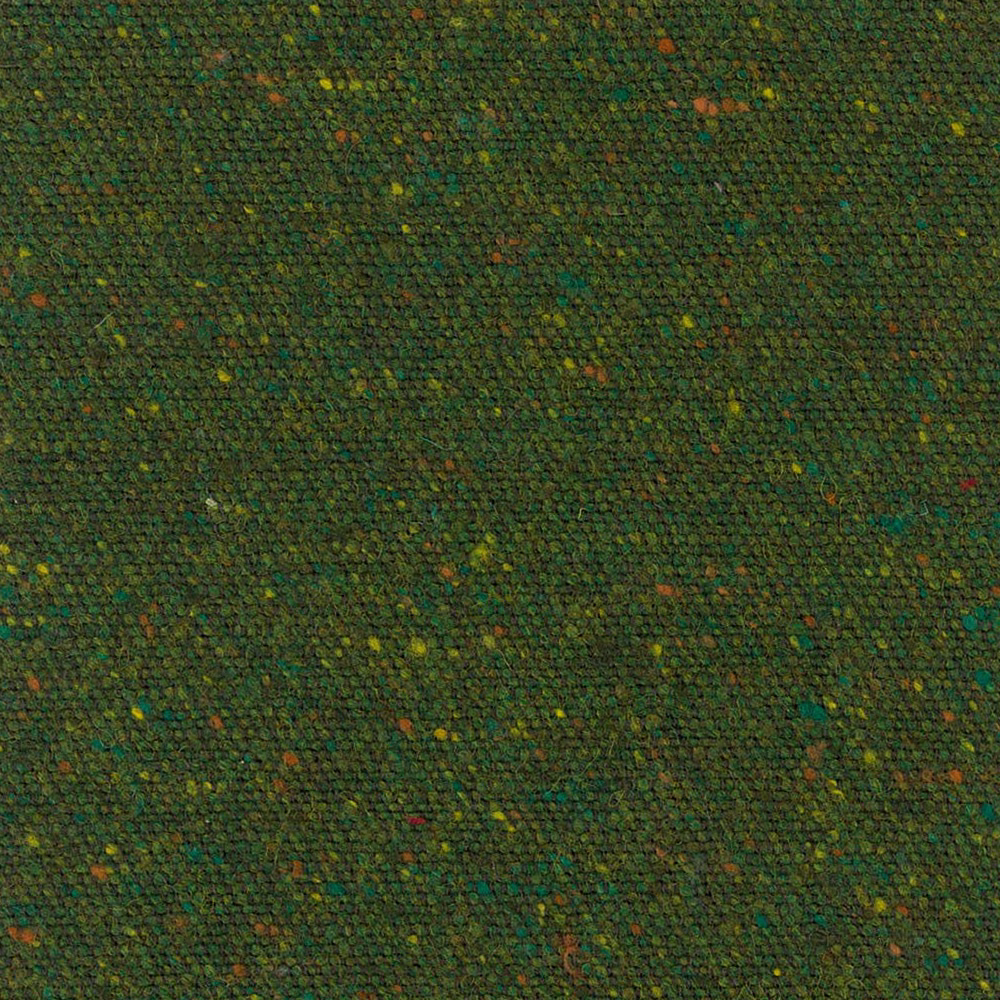 Deep evergreen nubby weave with scattered olive, teal, ochre and rust flecks