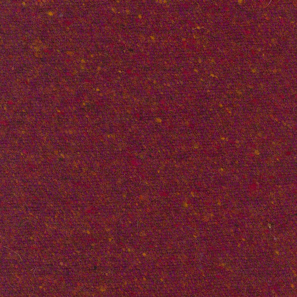 Close-up of burgundy-red woven fabric with russet and ochre flecks