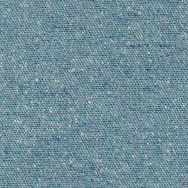 Muted blue-teal woven fabric with pale flecks and a softly nubby texture