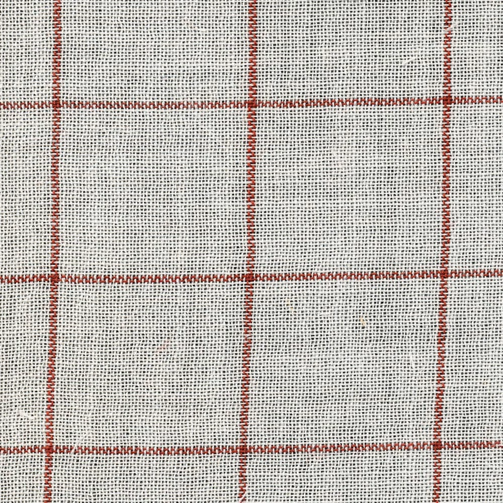 Warm ivory open-weave sheer with evenly spaced red windowpane checks