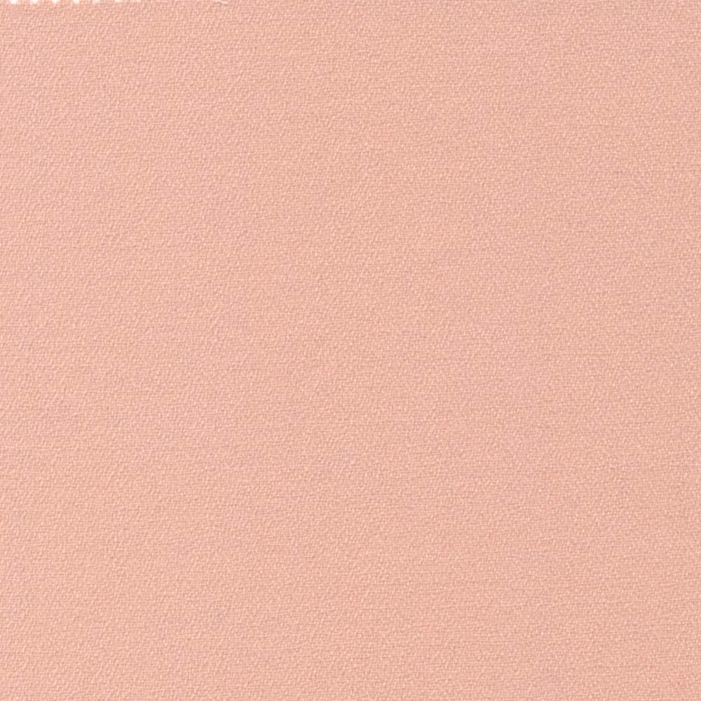 Pale warm buff crepe with a fine, softly pebbled woven texture