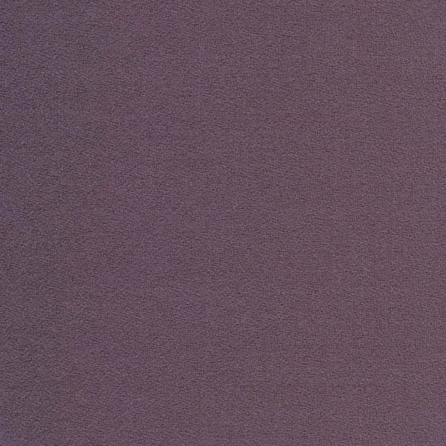 Close-up of muted grape-purple crepe with a fine, subtly pebbled texture