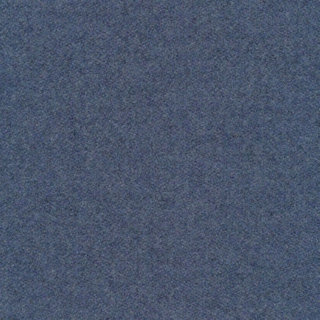 Close-up of muted slate-blue melton fabric with fine grey mottling and soft texture