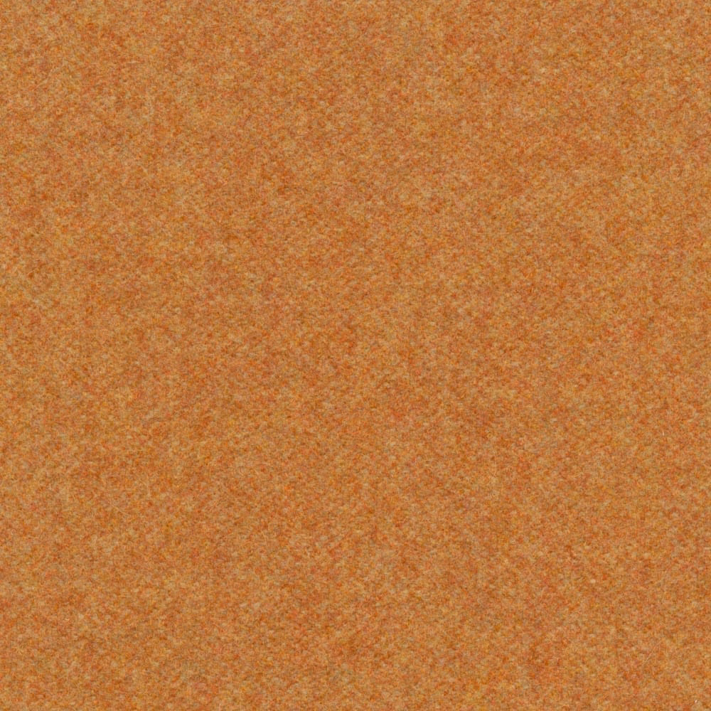 Warm cinnamon-orange melton texture with ochre flecks and subtle rust mottling