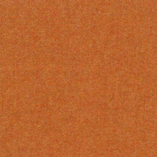 Close view of mottled ochre-gold melton weave with warm rust-orange flecks