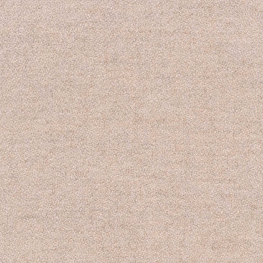 Close-up of warm oat-beige fabric with a fine, softly pebbled weave