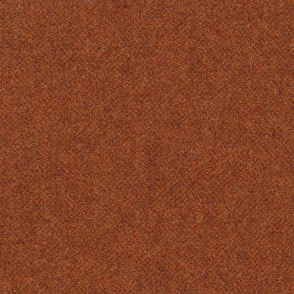 Close view of warm paprika-rust melton weave with subtle darker flecks