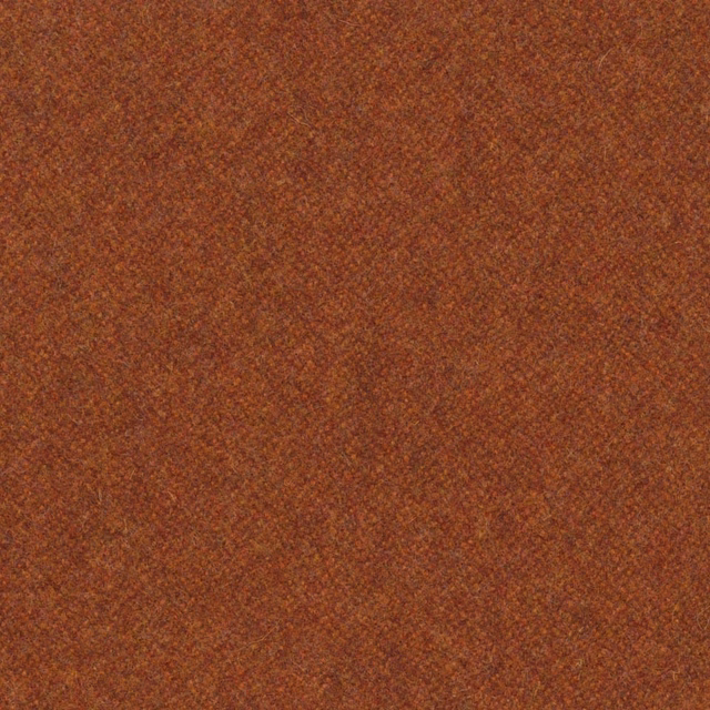 Close view of warm paprika-rust melton weave with subtle darker flecks