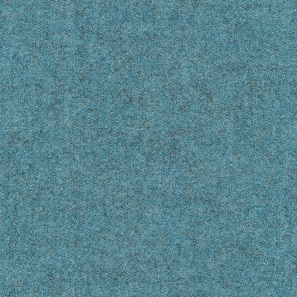 Close-up of mottled blue-teal melton texture with soft grey flecking