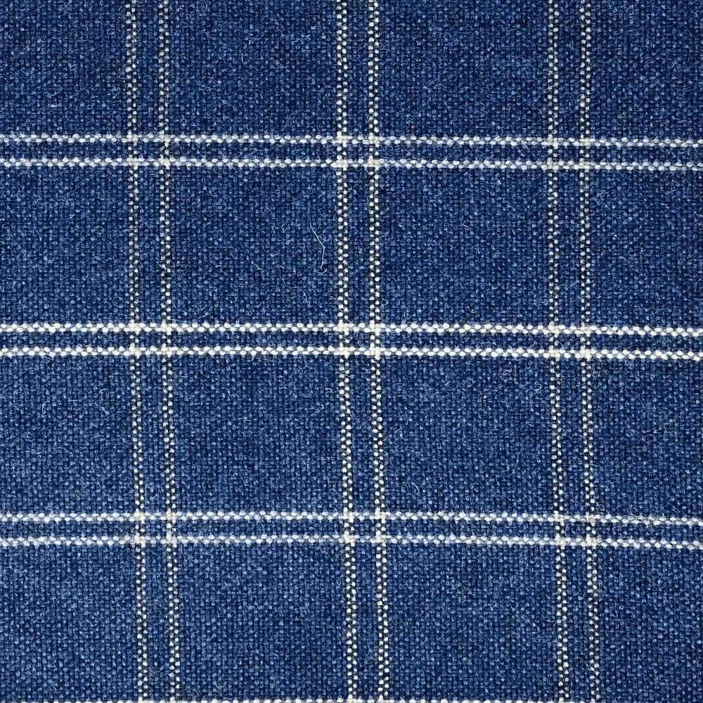 Close-up of cool denim-blue plaid with fine pale woven lines and texture