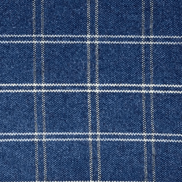 Close-up of cool denim-blue plaid with fine pale woven lines and texture
