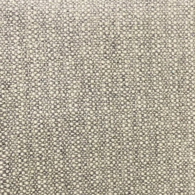 Close-up of silver-grey woven fabric with pale flecks and fine mottled texture