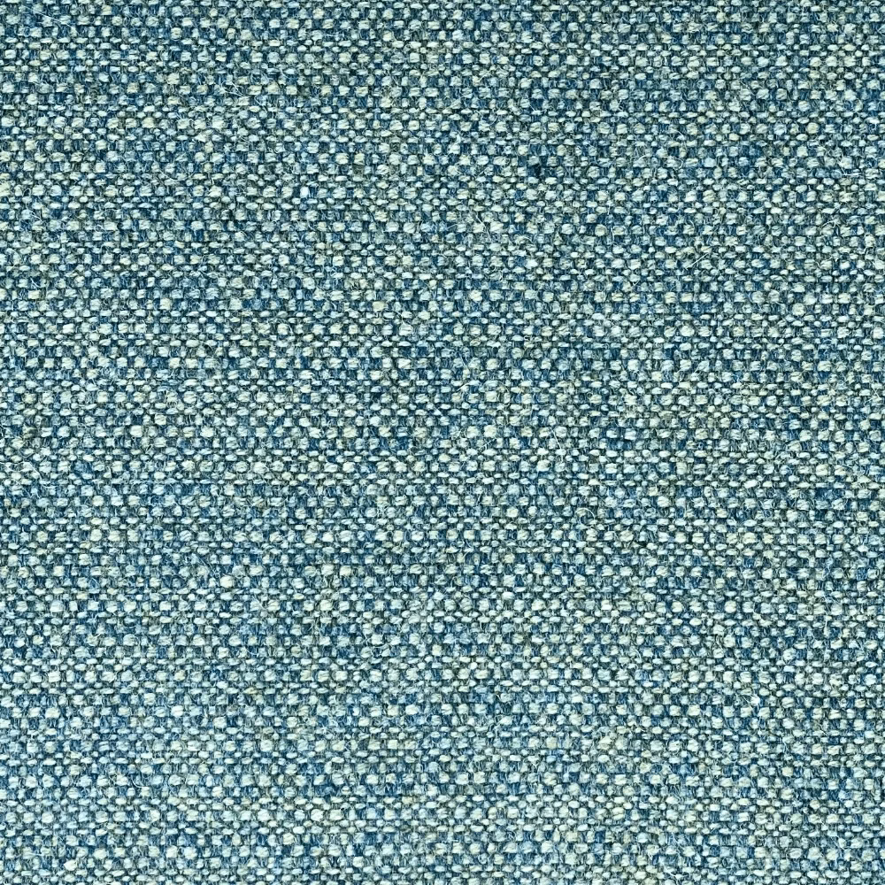 Close-up of muted teal woven fabric with tiny ivory flecks and nubby texture