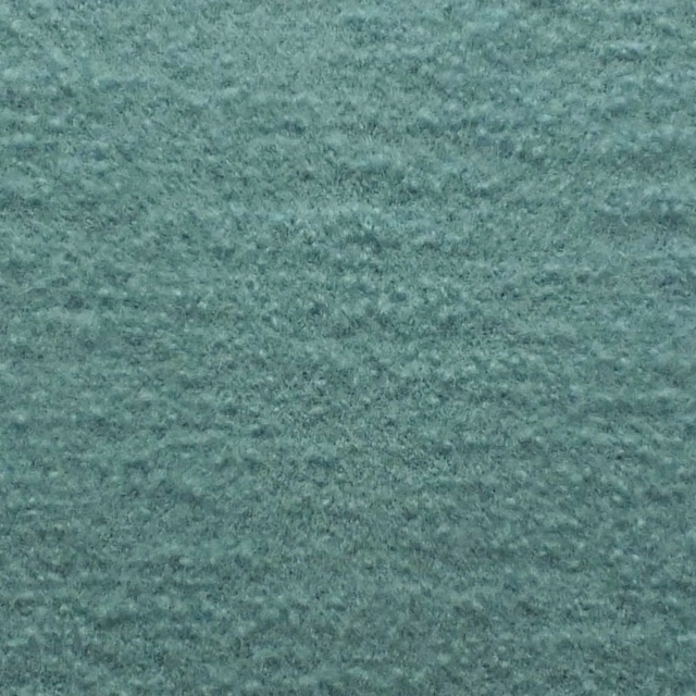 Mottled Adriatic blue-green boucle with a soft, nubby woven surface