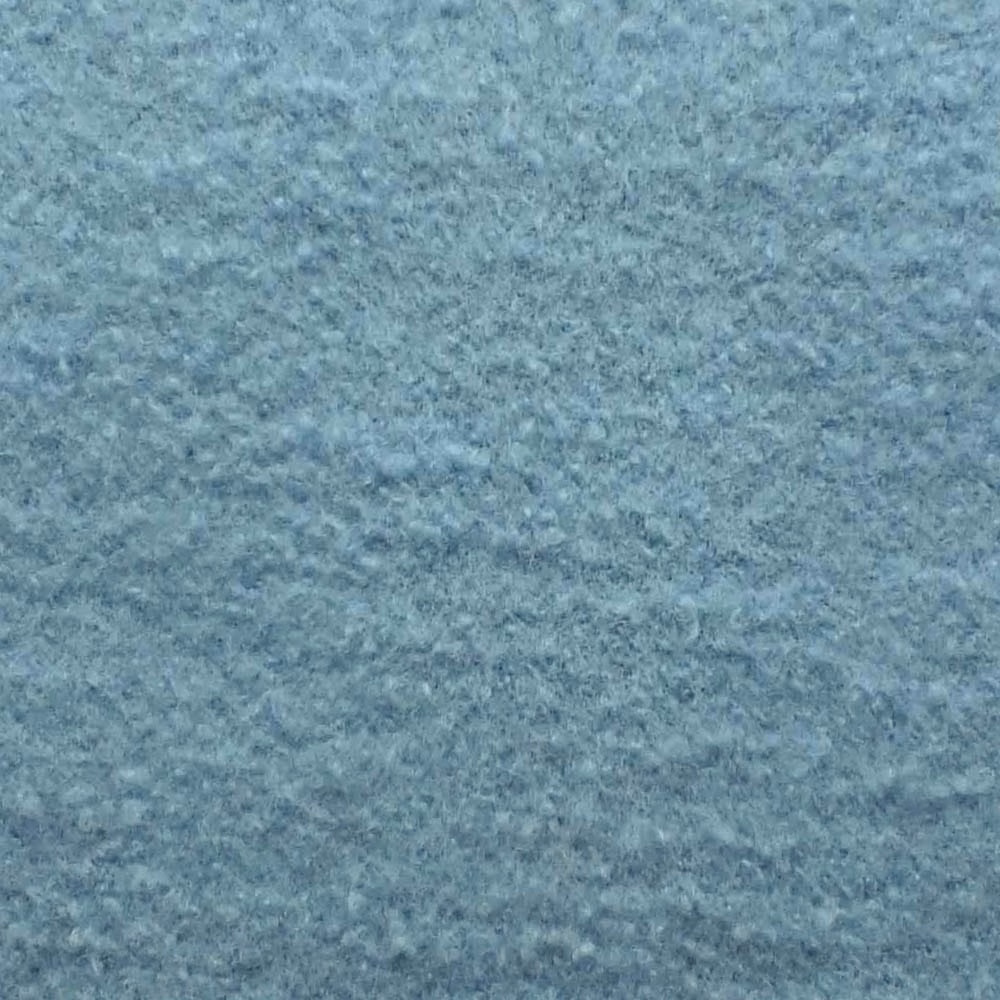 Close-up of pale Arctic blue-grey bouclé with a softly mottled, nubby texture