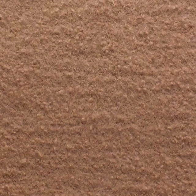 Warm buff-brown bouclé fabric with a softly mottled, nubby surface