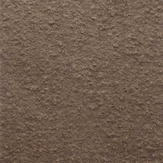 Close-up of warm cappuccino-brown bouclé with dense, irregular nubby texture