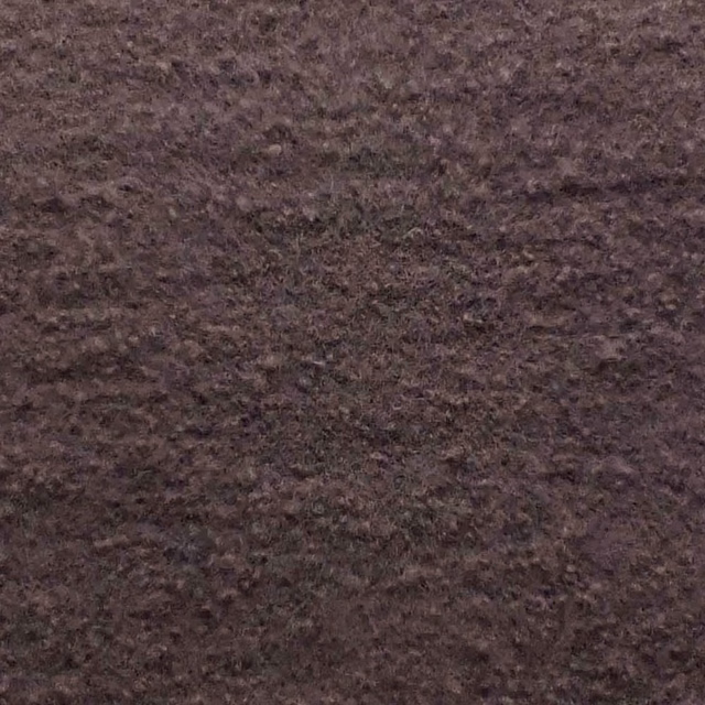 Deep brown-plum mauve bouclé swatch showing dense, irregular nubby texture